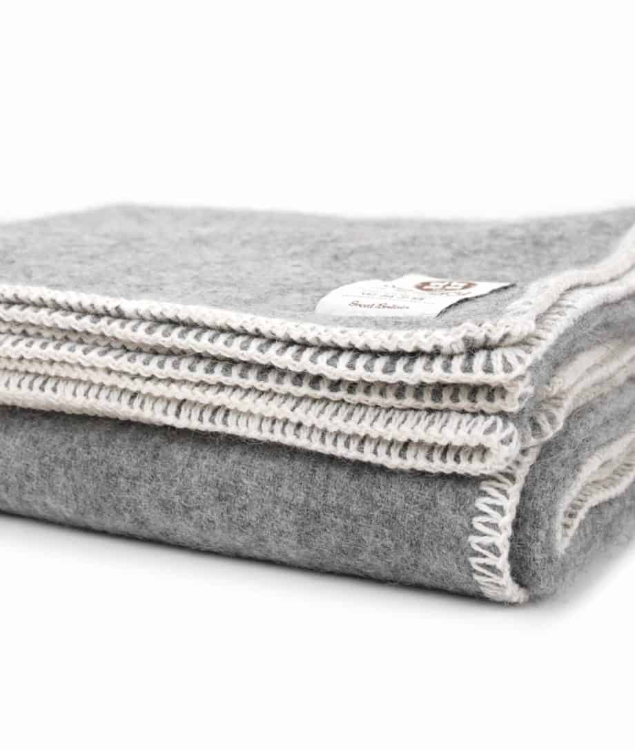 cosy large grey blanket throw  with white blanket stitch