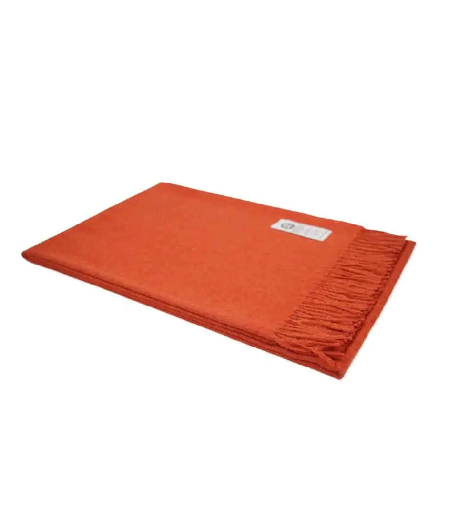 luxury baby alpaca wool throw blanket in deep orange colour