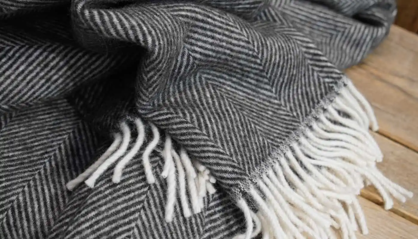herringbone Scnadinavian pure new wool cosy blanket throw in charcoal grey colour