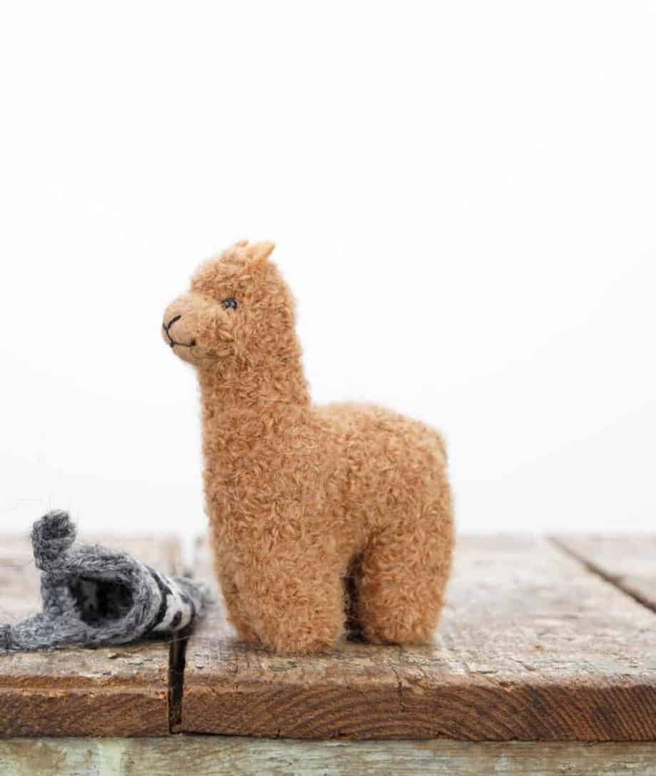 cute brown alpaca soft toy with grey hat