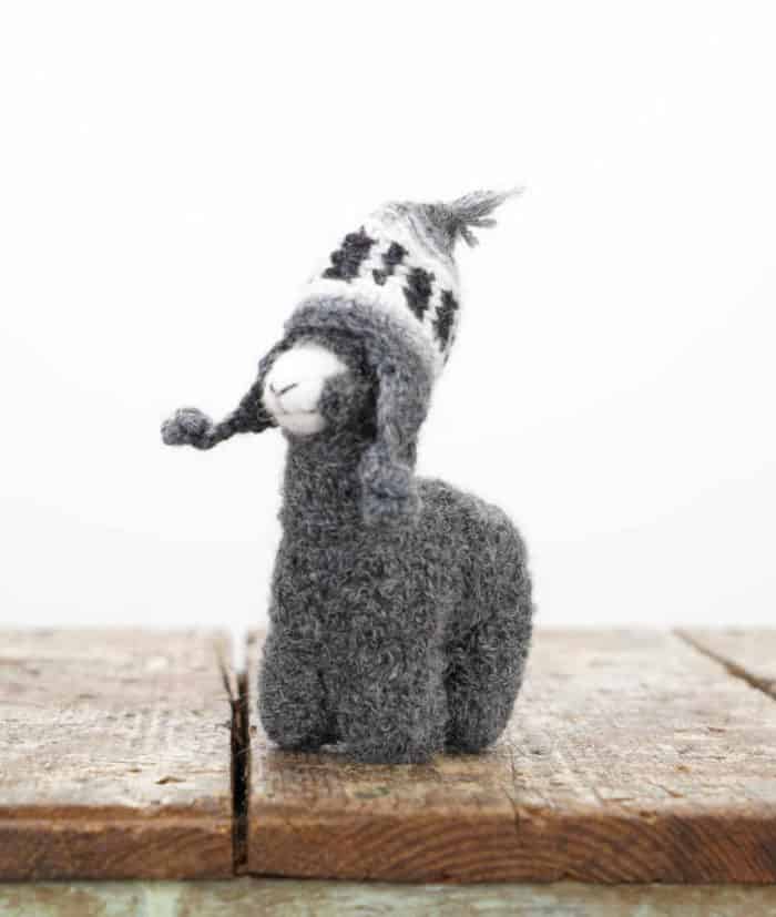cute and cuddly baby alpaca soft toy with hand crocheted hat