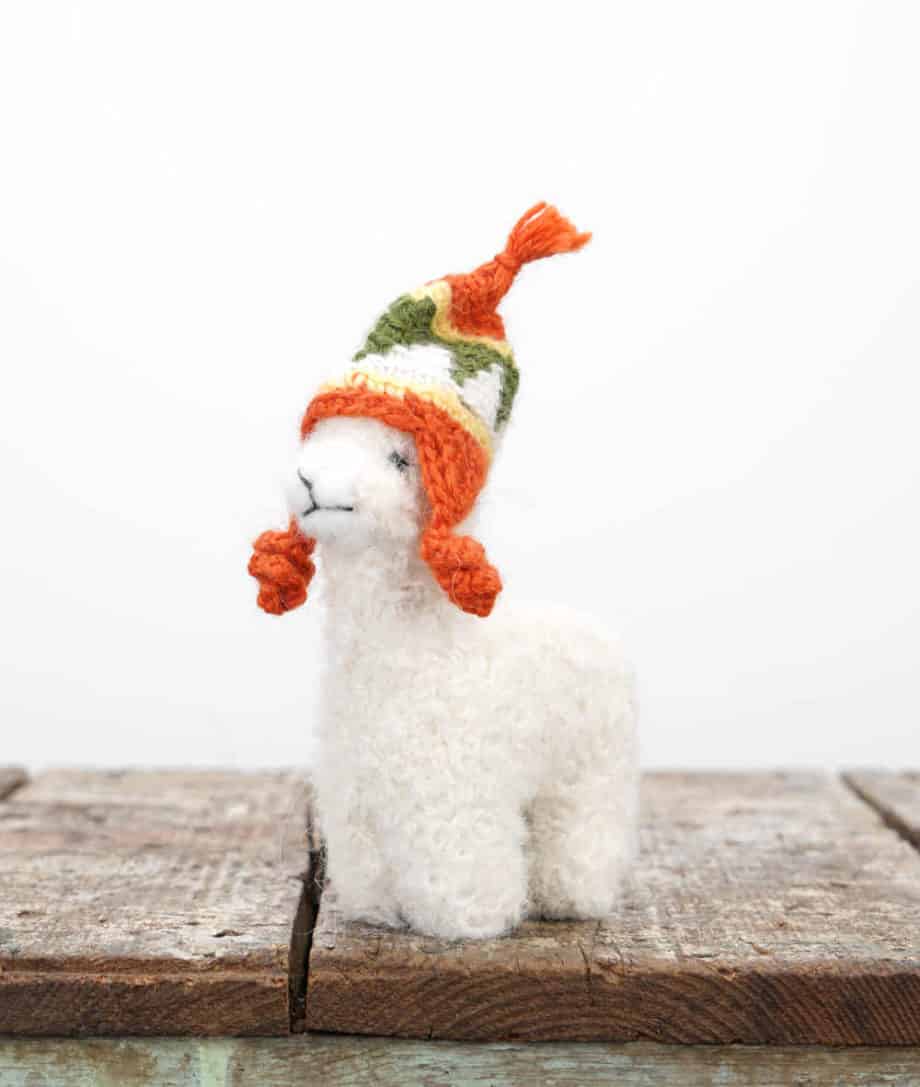 adorable handmade alpaca soft toy with orange hat