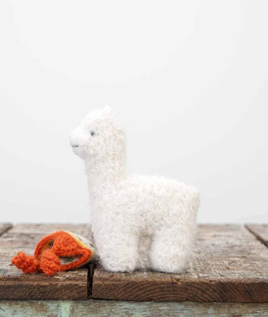 cute adorable alpaca soft toy with orange hat