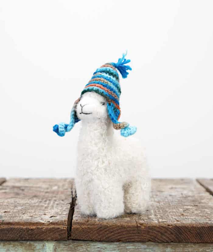 super cute handmade baby alpaca soft toy with turquoise hat