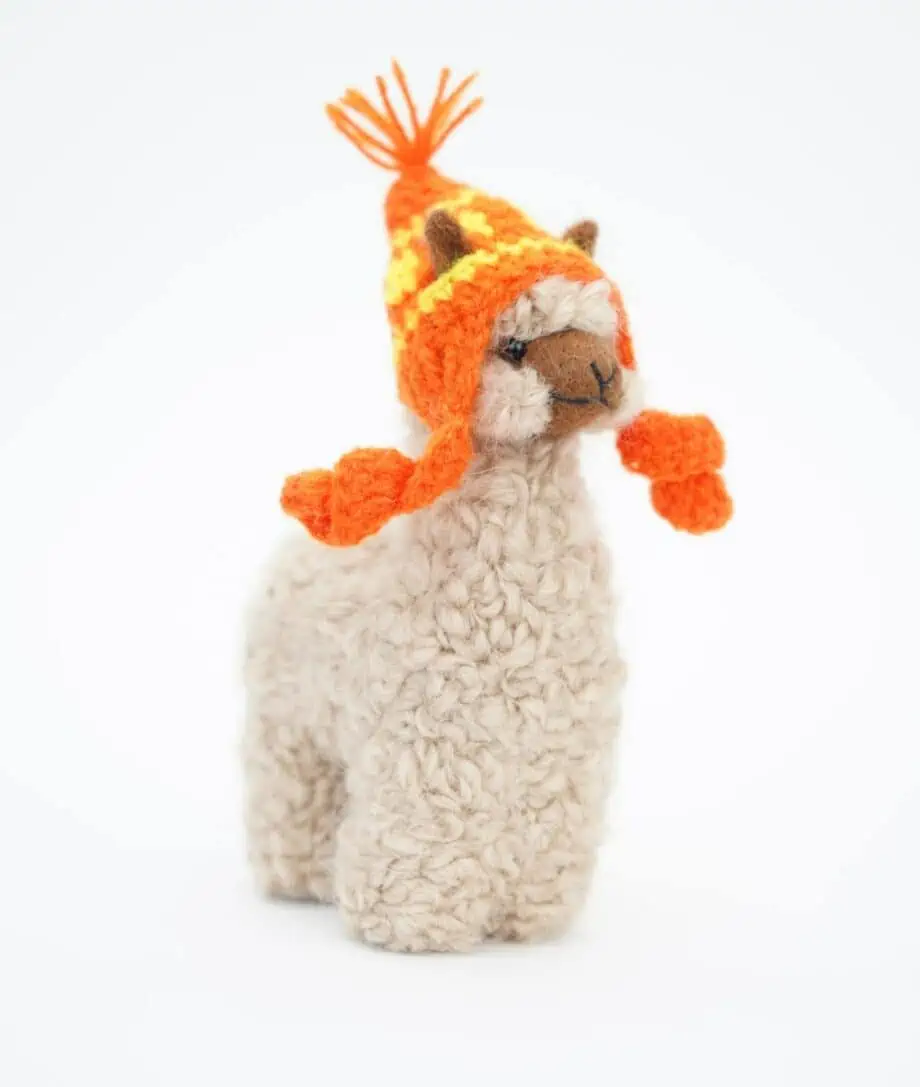 adorable beige baby alpaca soft toy with orange hat