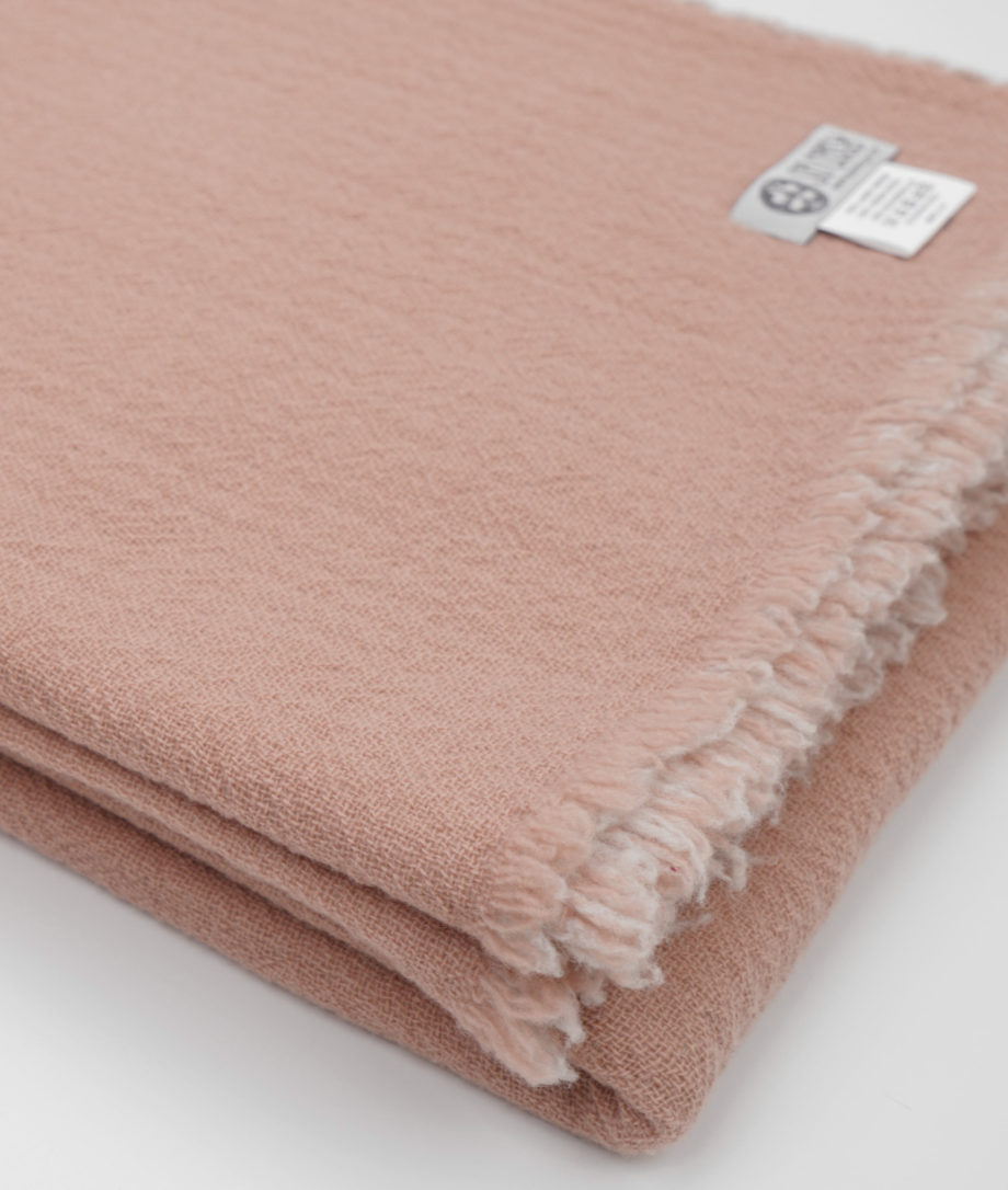 reversible capri merino wool throw in light pink grey colour