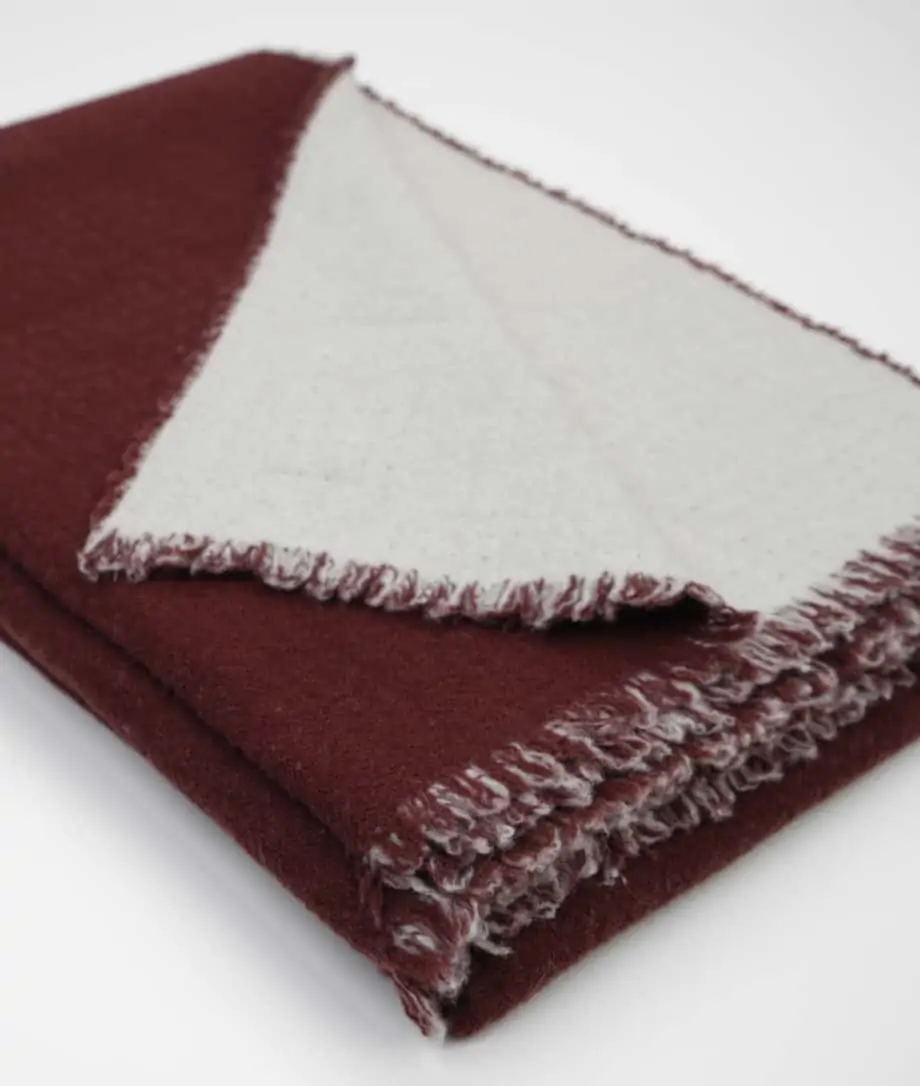 capri throw made from soft merino wool in tawny port grey colour