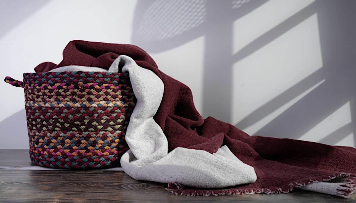 capri reversible cosy merino wool blanket and jute basket