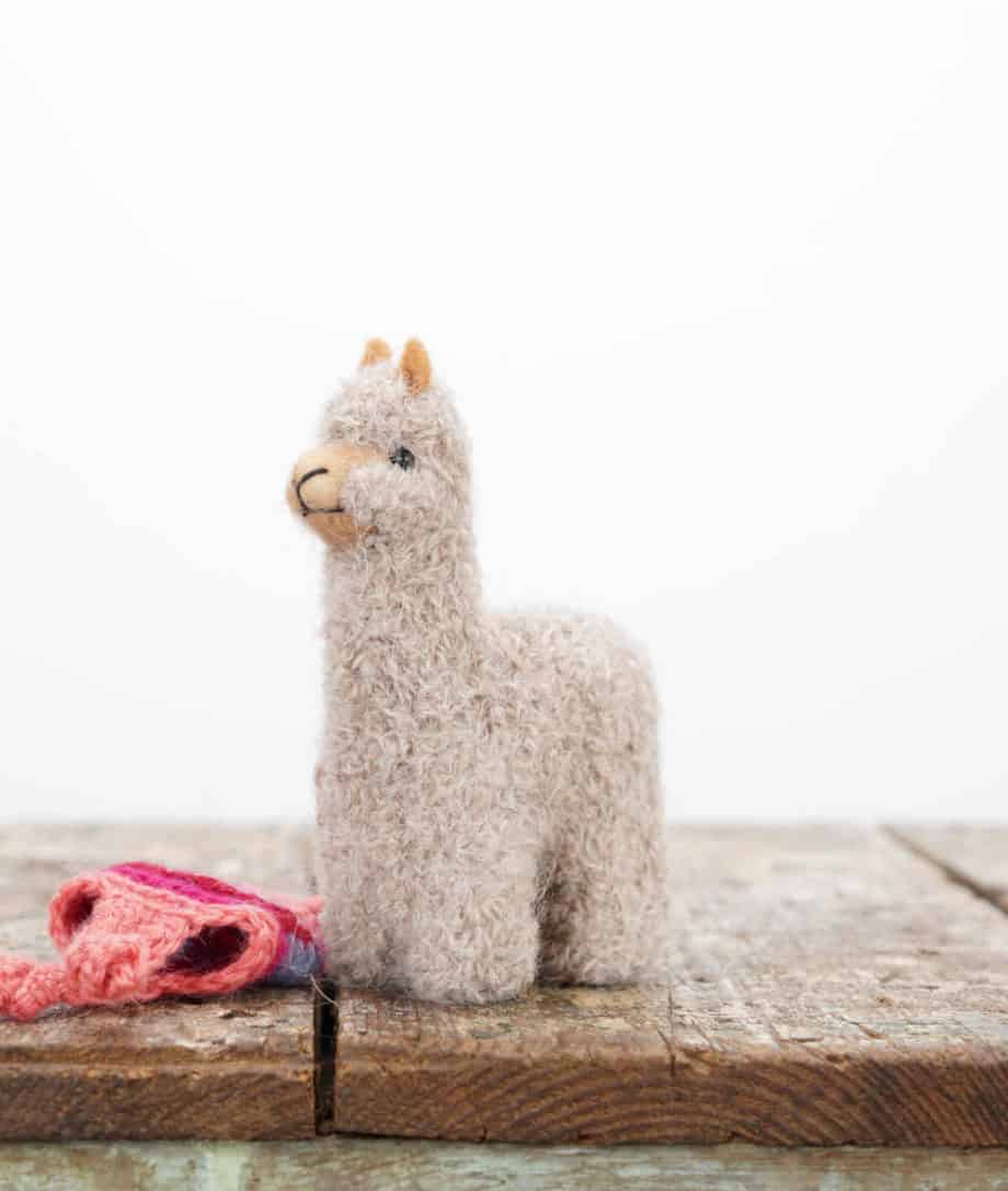handmade baby alpaca toy with pink hat
