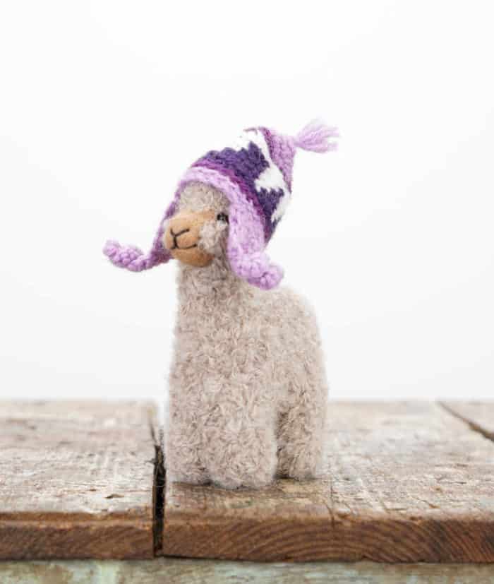 super cute handmade Peruvian baby alpaca soft toy with a lilac hat