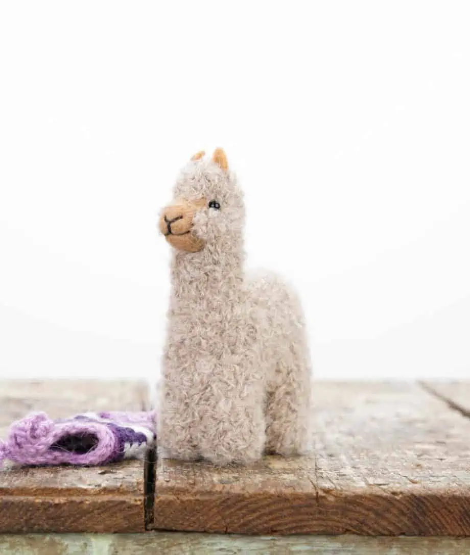 cute handmade baby alpaca soft toy with lilac colour hat