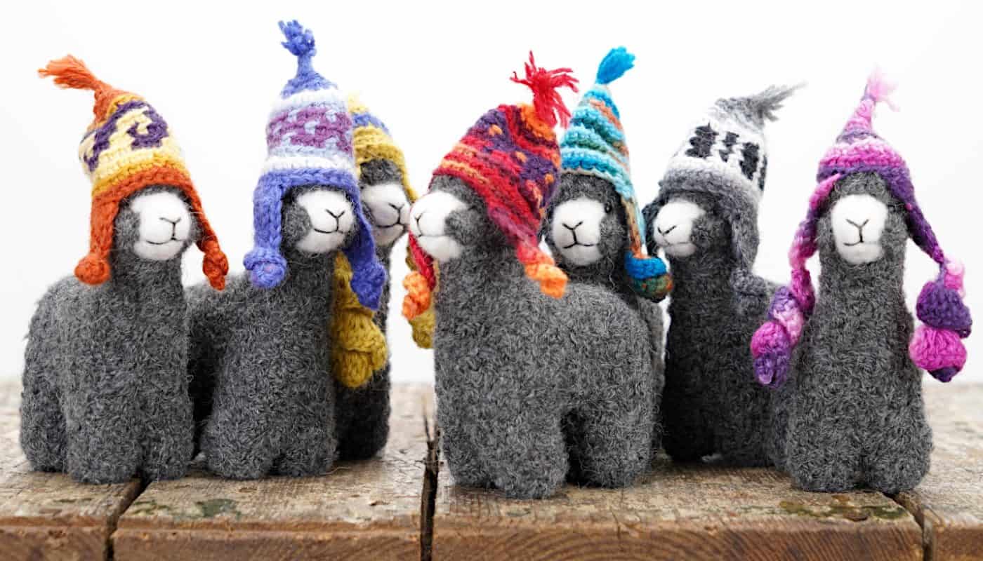 grey colour alpaca toys with a hats
