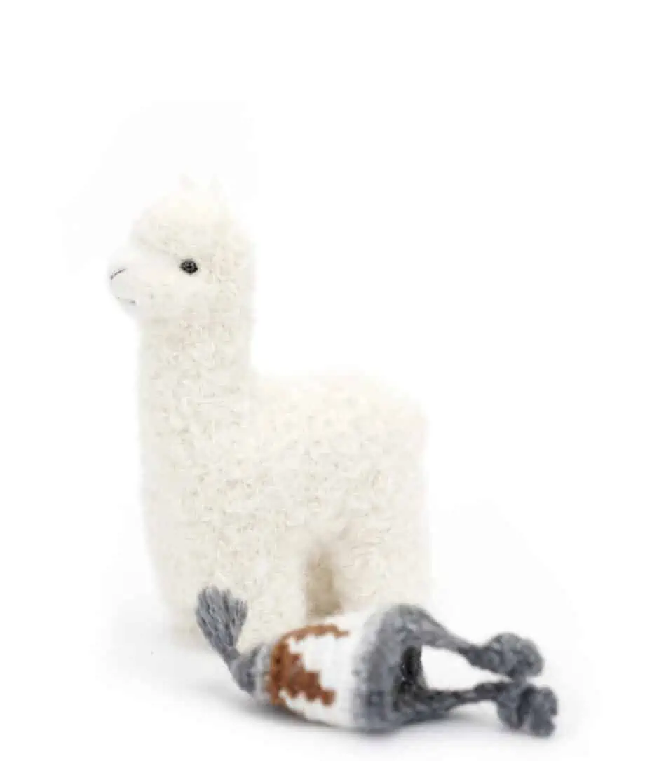 cosy baby alpaca soft toy with a grey hat