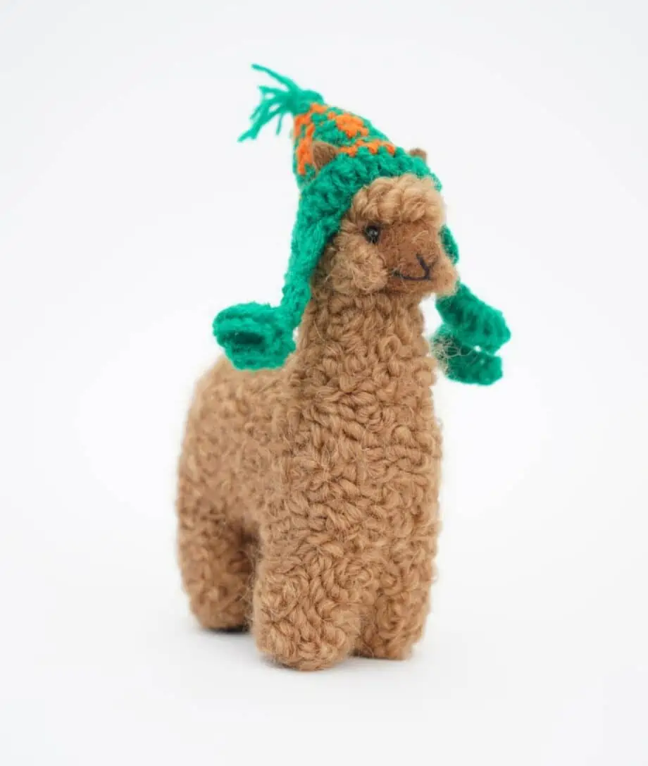 adorable brown baby alpaca soft toy with green hat