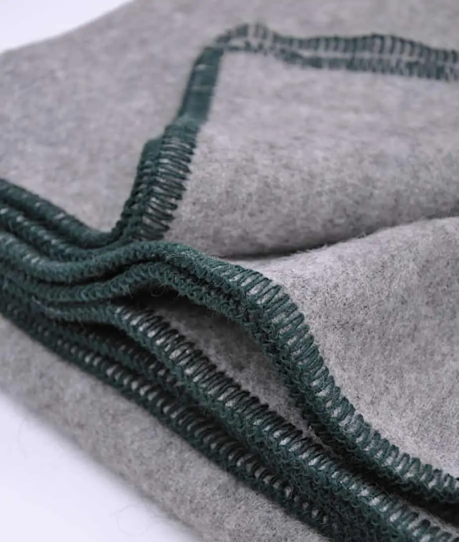 cosy-grey-throw-with-blanket-stitch-green