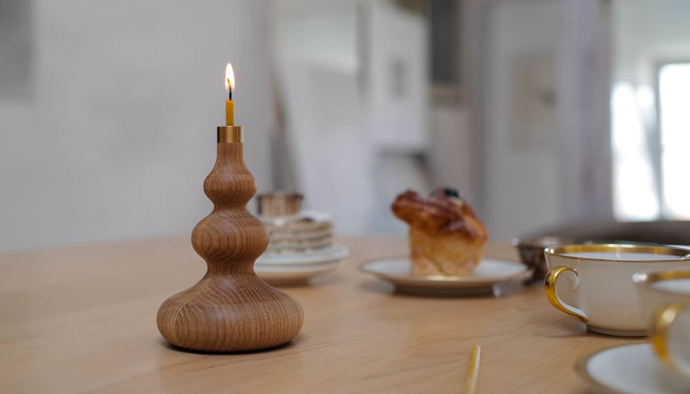 hand crafted oiled oak candle stick holder with custom brass detail