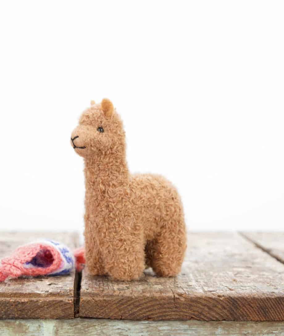 cosy baby alpaca soft toy with pink hat