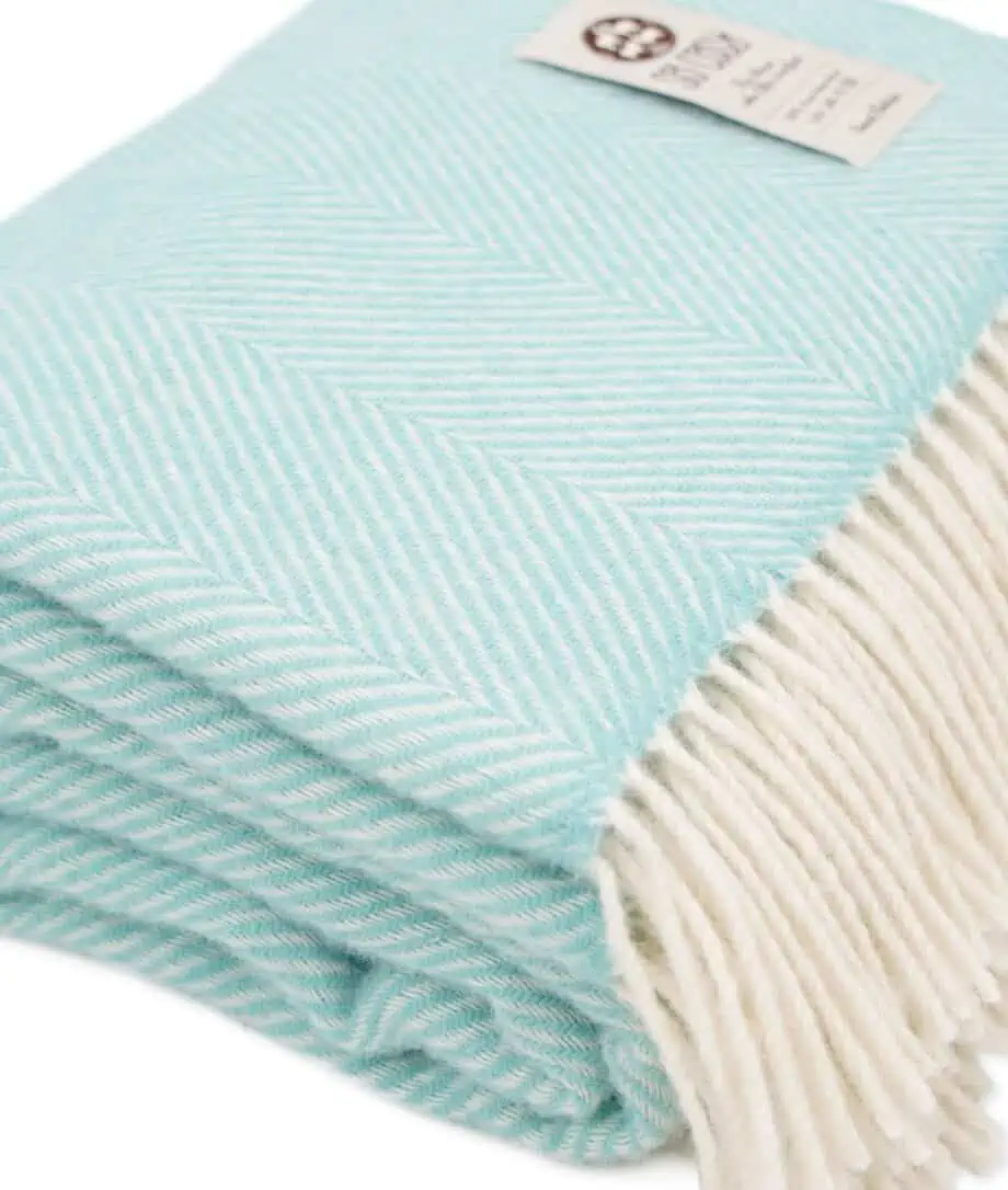 cosy pure wool blanket in aqua haze blue