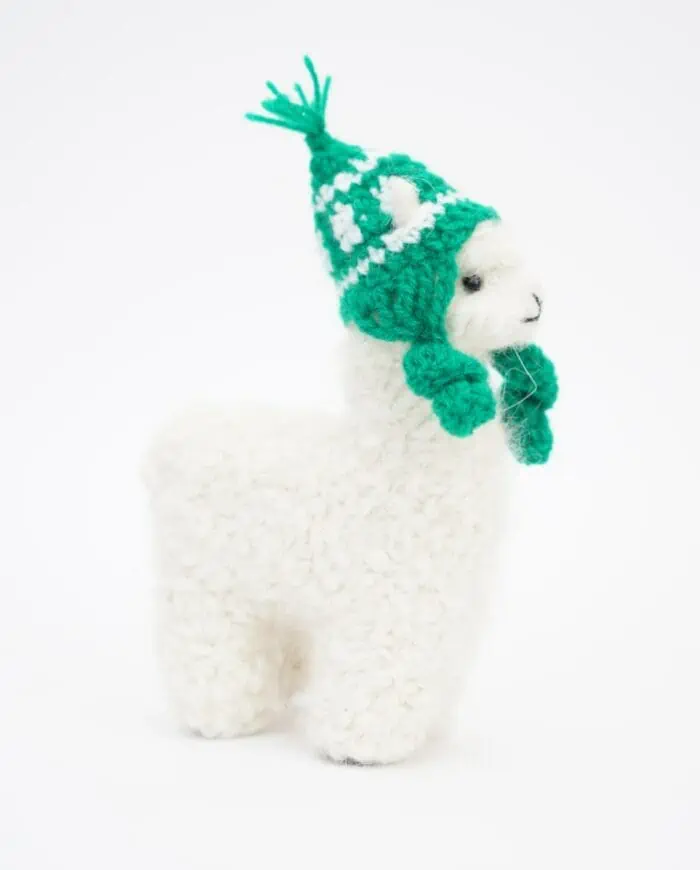 cute cosy white baby alpaca soft toy with green hat