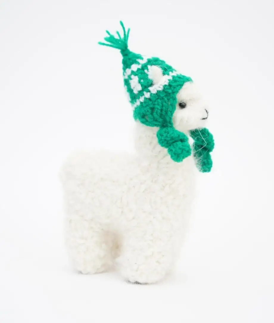 cute cosy white baby alpaca soft toy with green hat