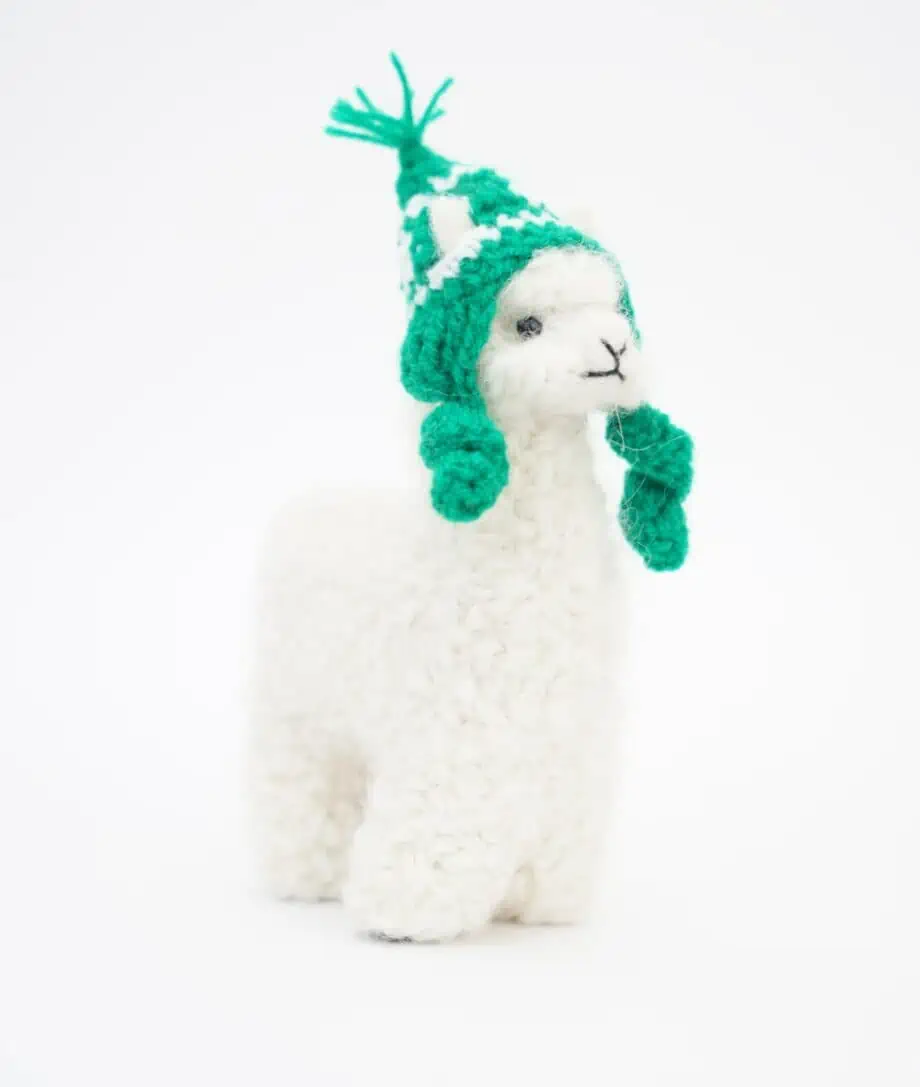 cosy white baby alpaca soft toy with green hat