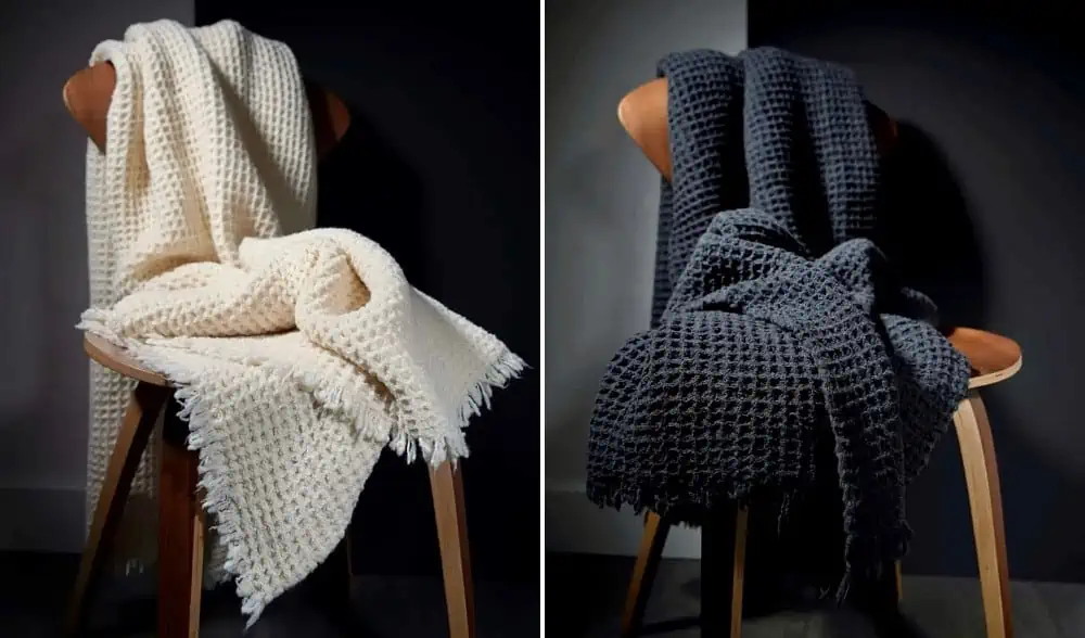 Stylish blankets on chairs