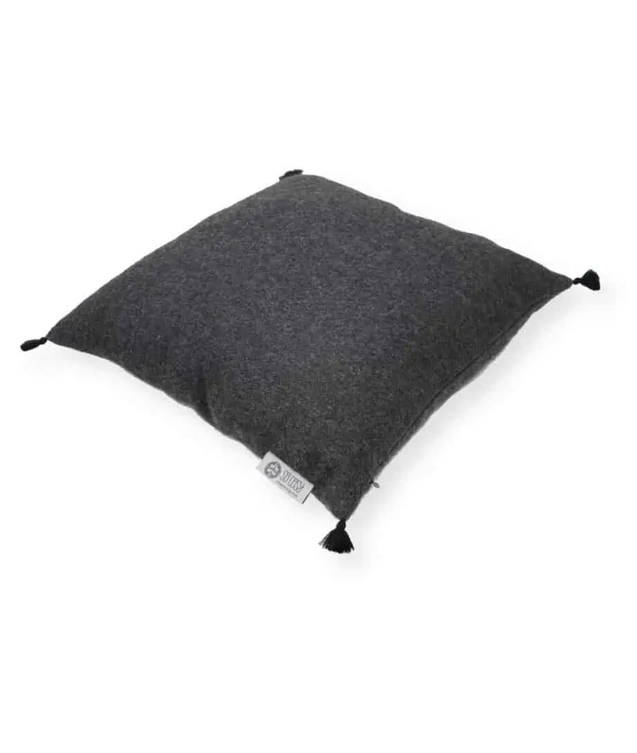 Callao charcoal grey cushion with pom poms
