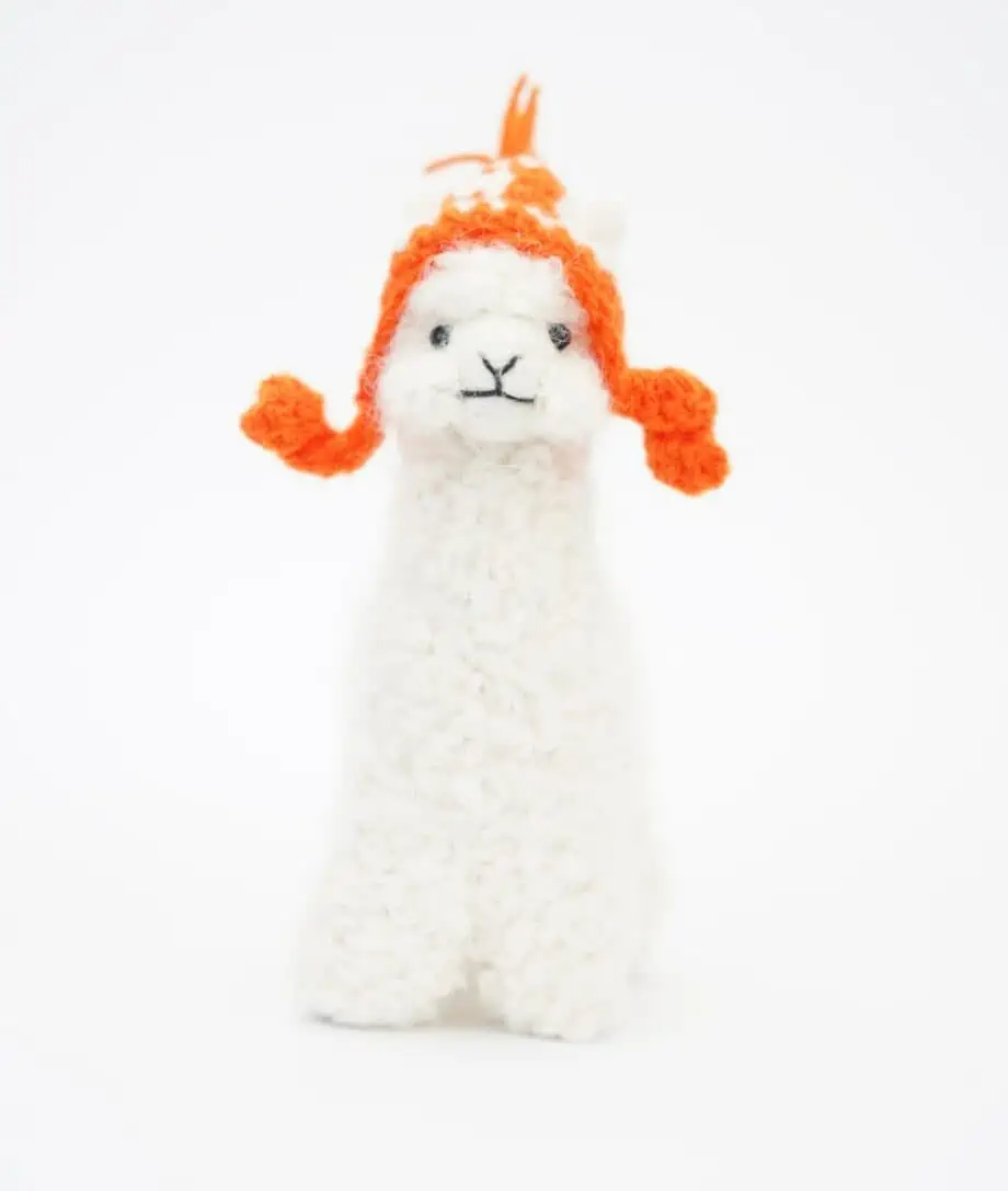 cute baby alpaca soft toy with an orange hat