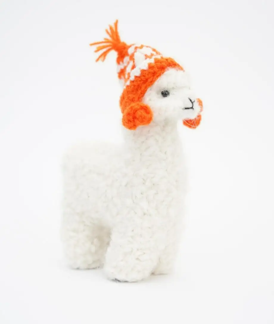 Cute handmade baby alpaca soft toy with an orange hat