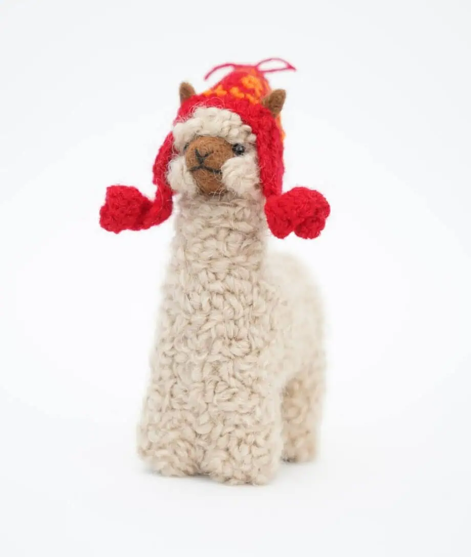 cure beige baby alpaca soft toy with a red hat