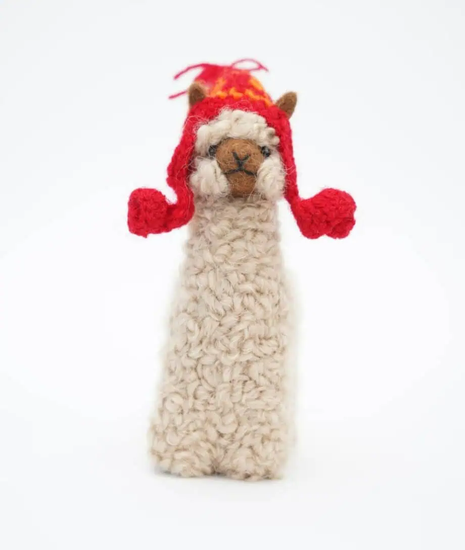hand crafted baby alpaca soft toy with a red hat