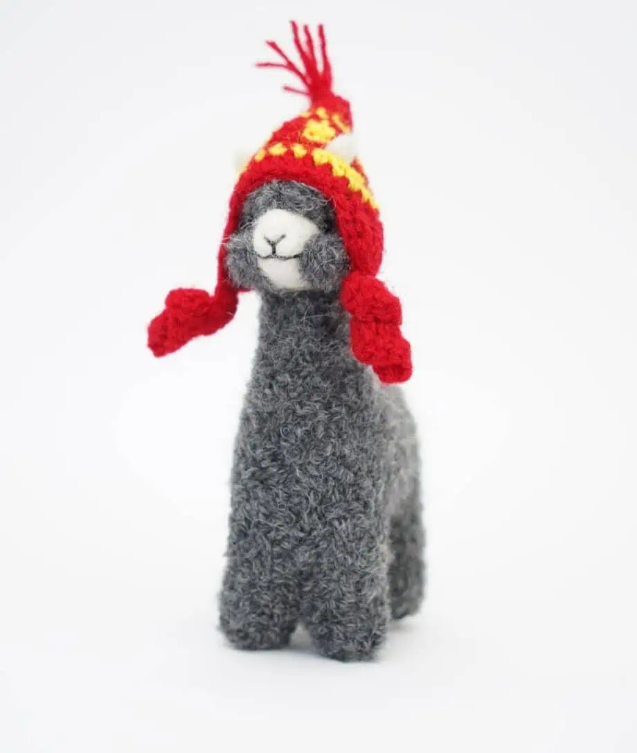 adorable grey alpaca soft toy with a red hat
