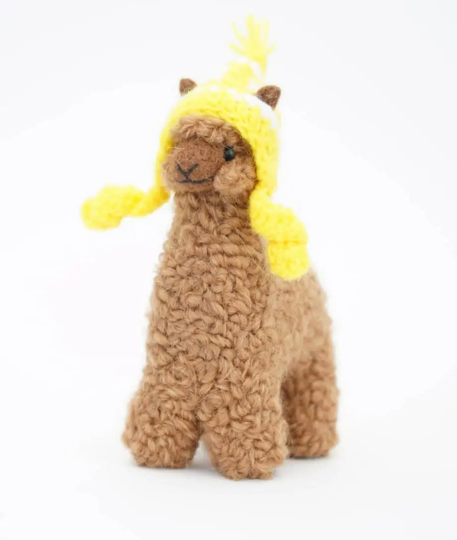 cute brown baby alpaca soft toy with a yellow hat