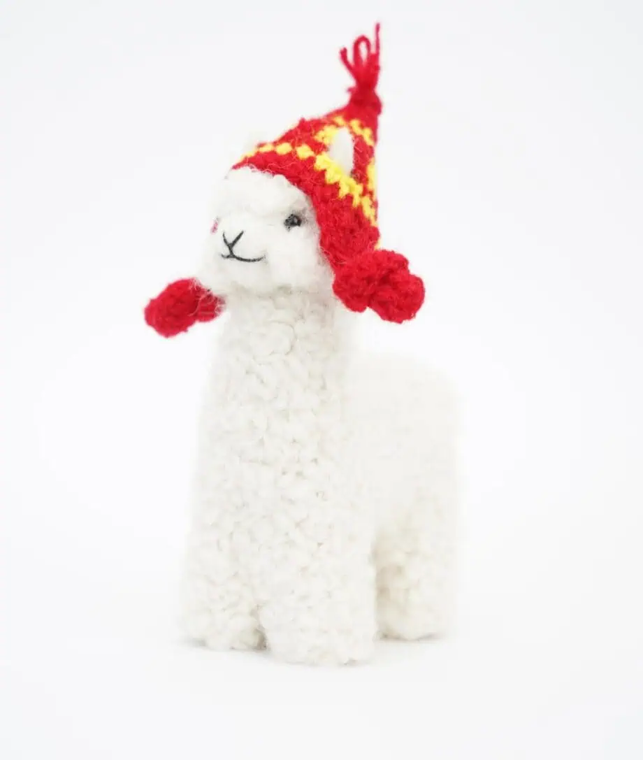 white baby alpaca soft toy with a red hat
