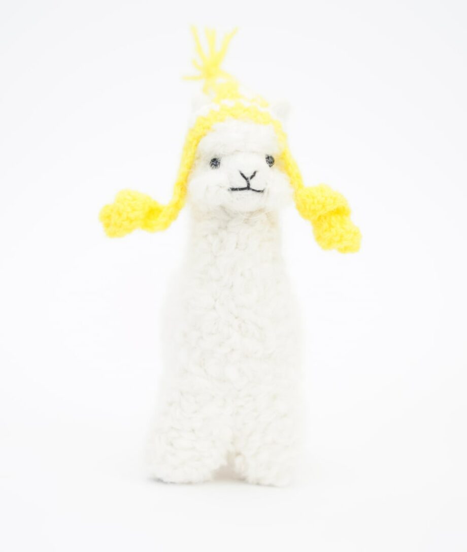 adorable baby alpaca soft toy with a yellow hat