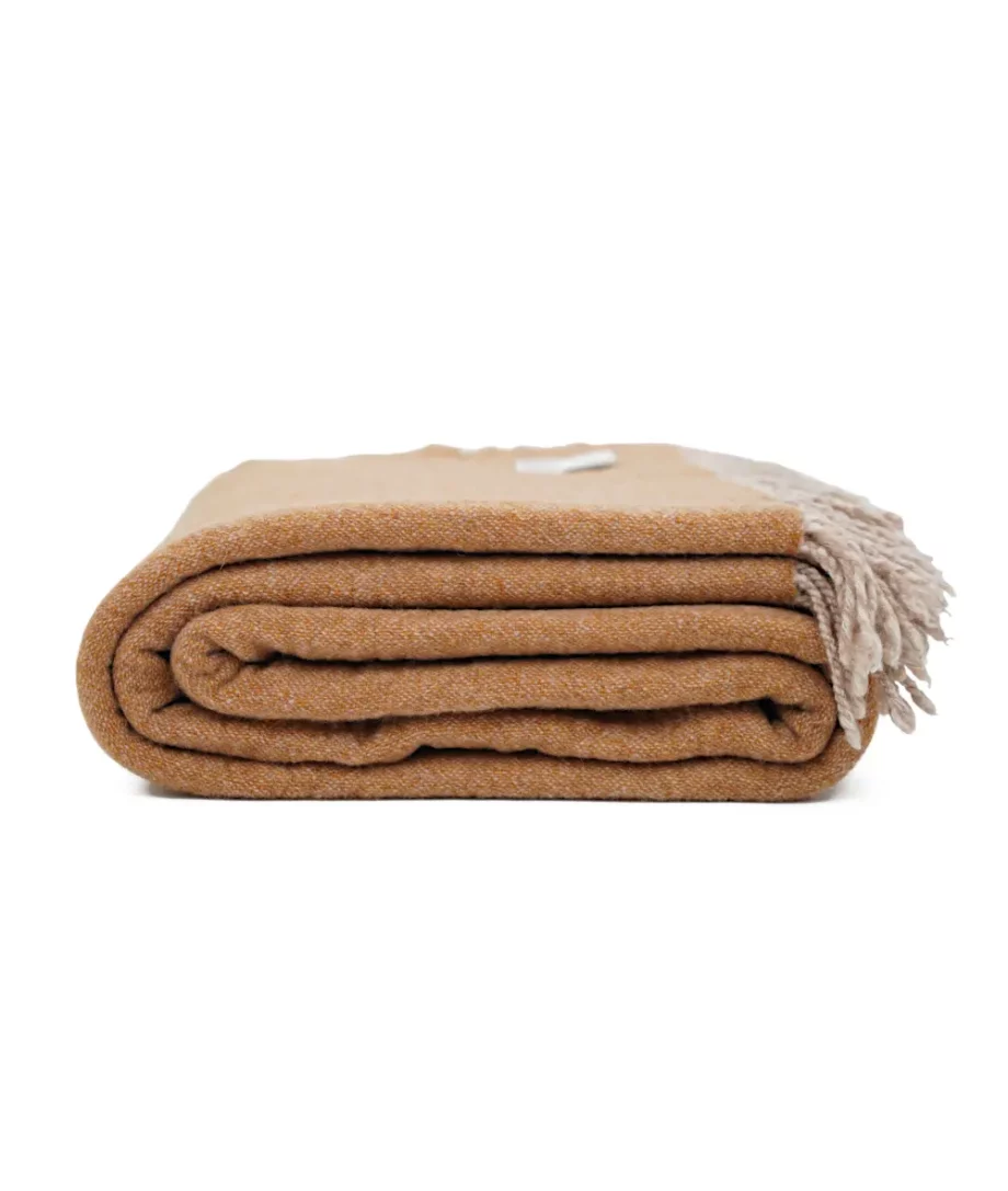 dio extra fine merino wool reversible throw blanket in okra beige