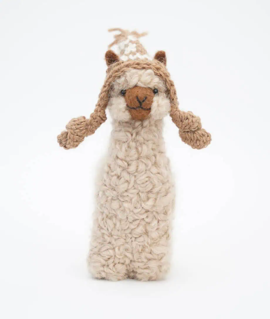 beige cosy alpaca with a brown hat
