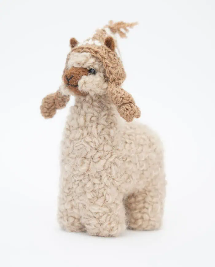 cure baby alpaca soft toy with a brown hat