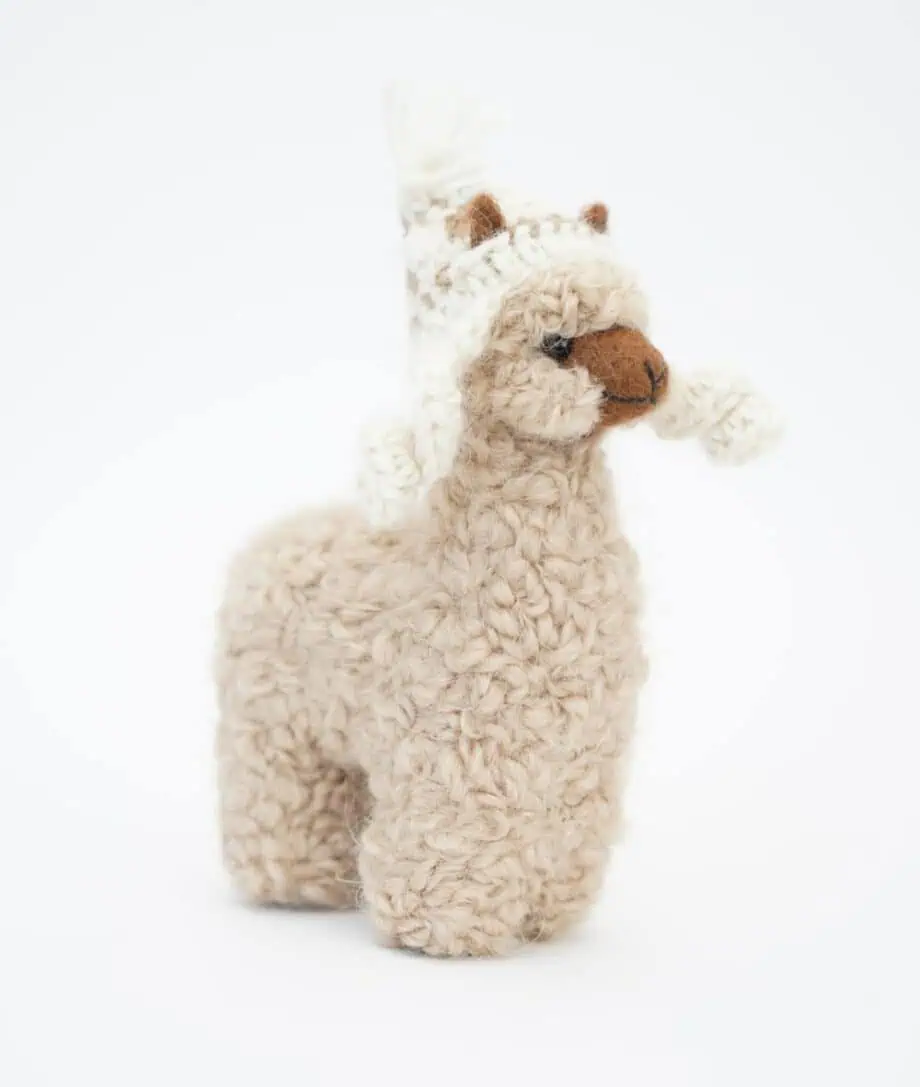 cute cosy baby alpaca soft toy with a cream hat
