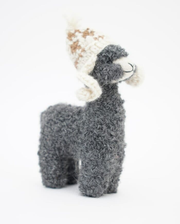 cute grey baby alpaca soft toy with a cream colour hat