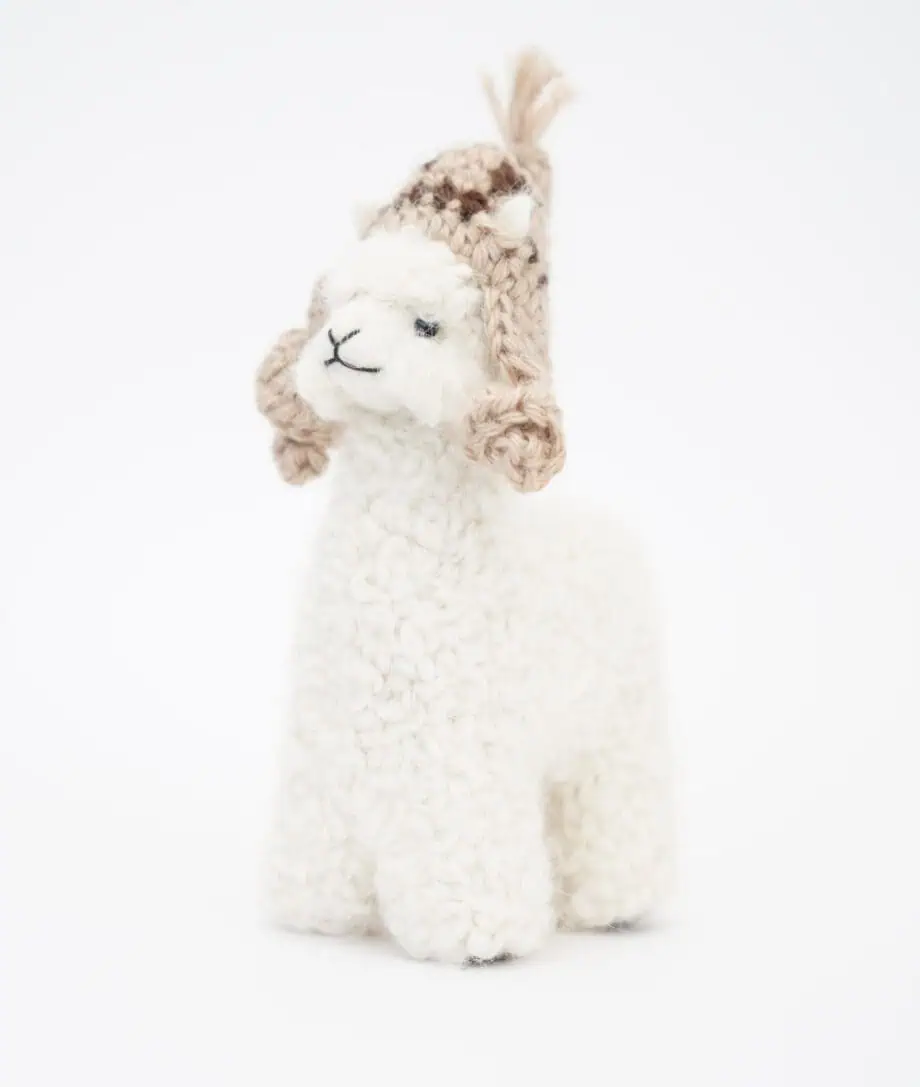 adorable white baby alpaca soft toy with a beige hat