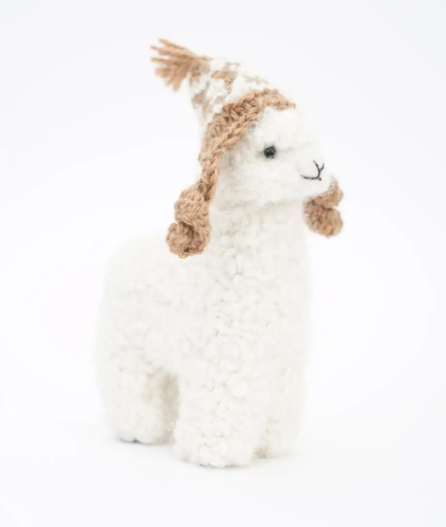 white alpaca with a brown hat