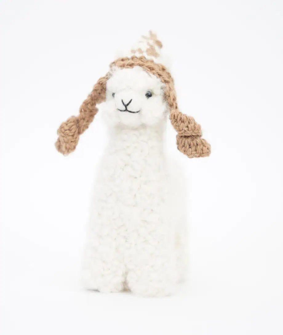 sweet white baby alpaca soft toy with a brown hat