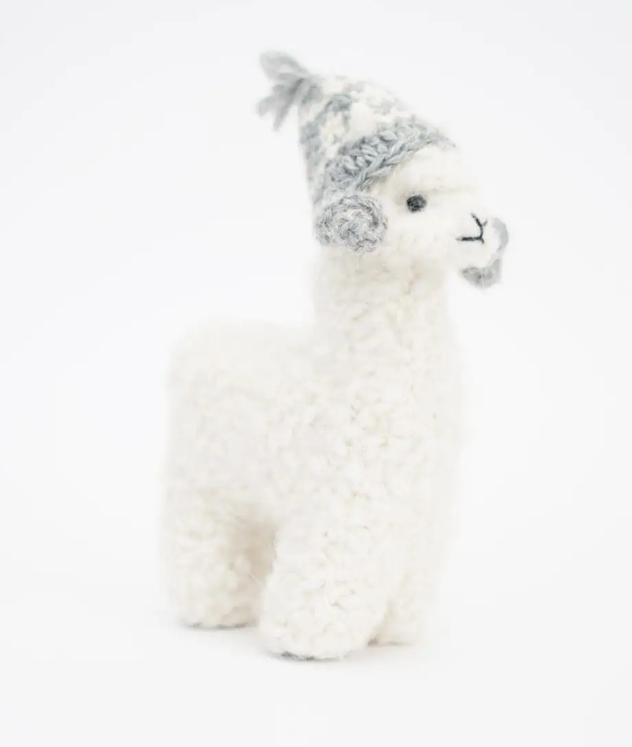 sweet baby alpaca soft toy with a grey crochet hat