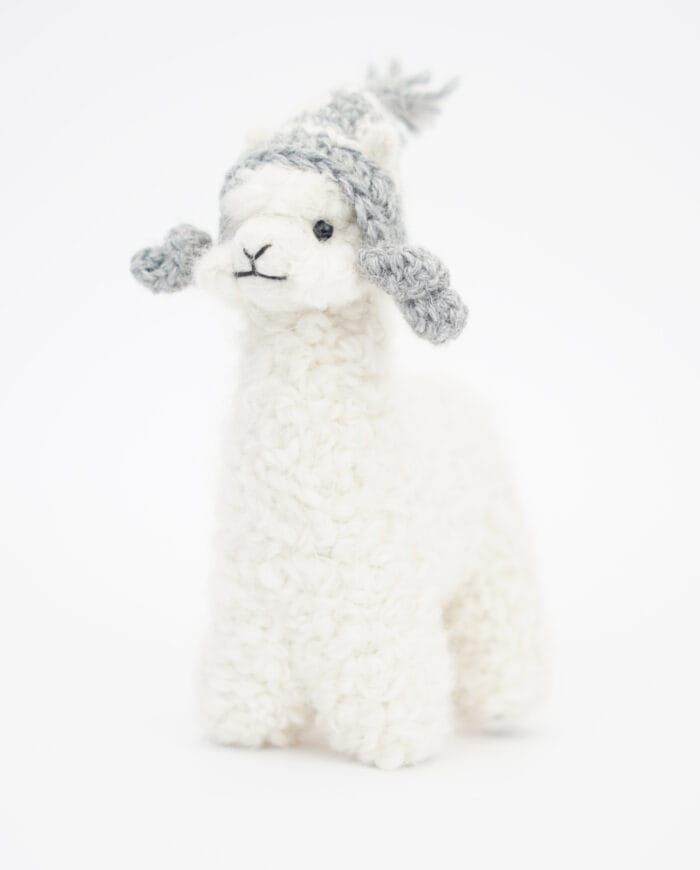 adorable sweet white baby alpaca soft toy with a grey haat