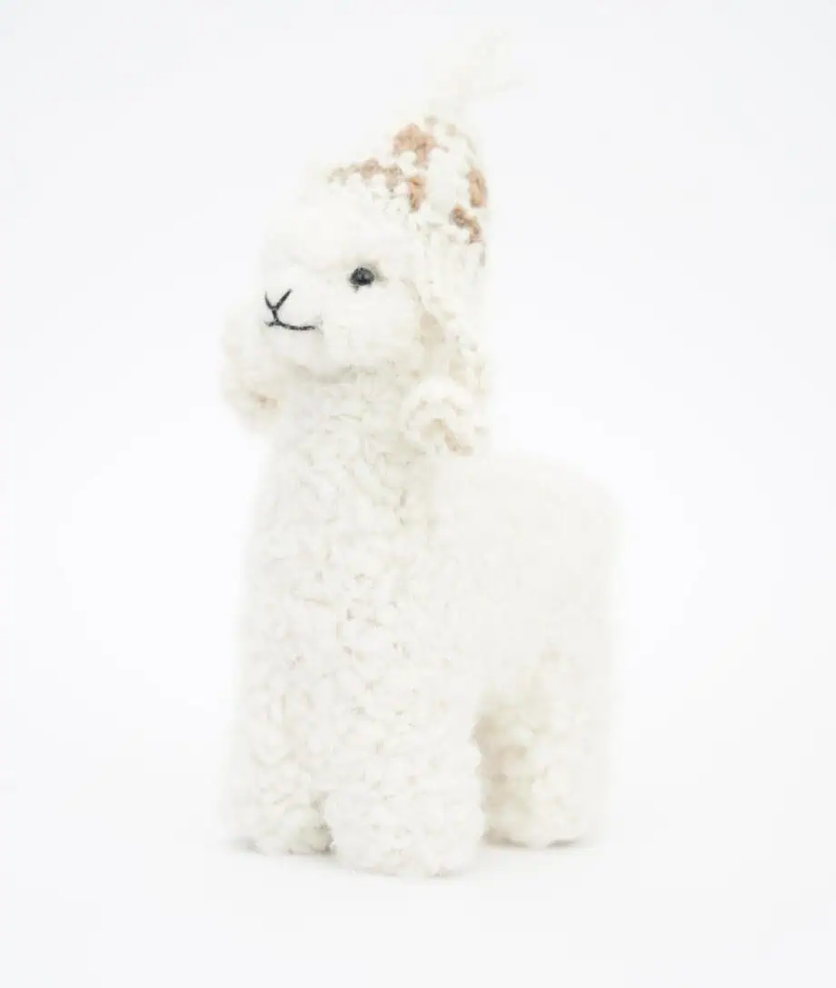 cosy white baby alpaca soft toy with a cream colour hat